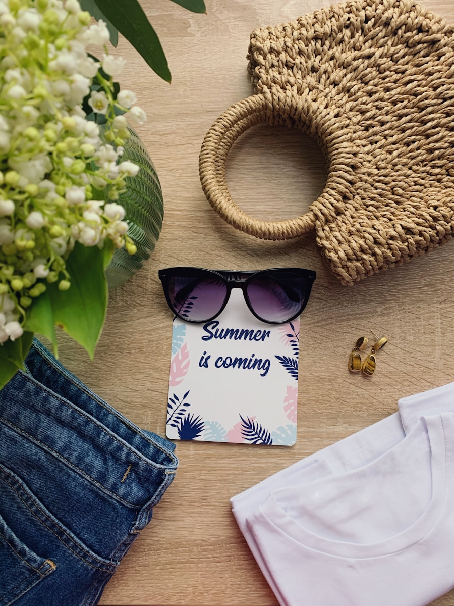black sunglasses beside white and pink paper bag