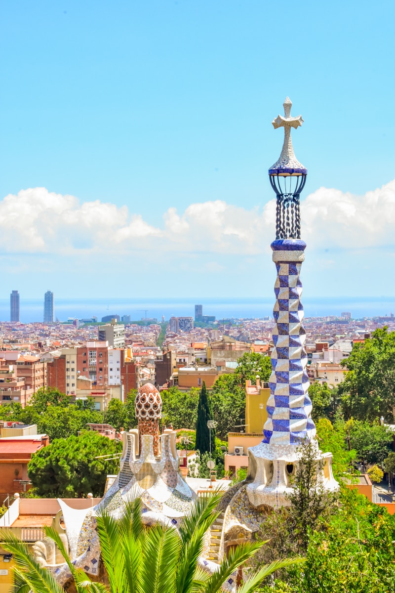 A tall tower with a cross on top of it