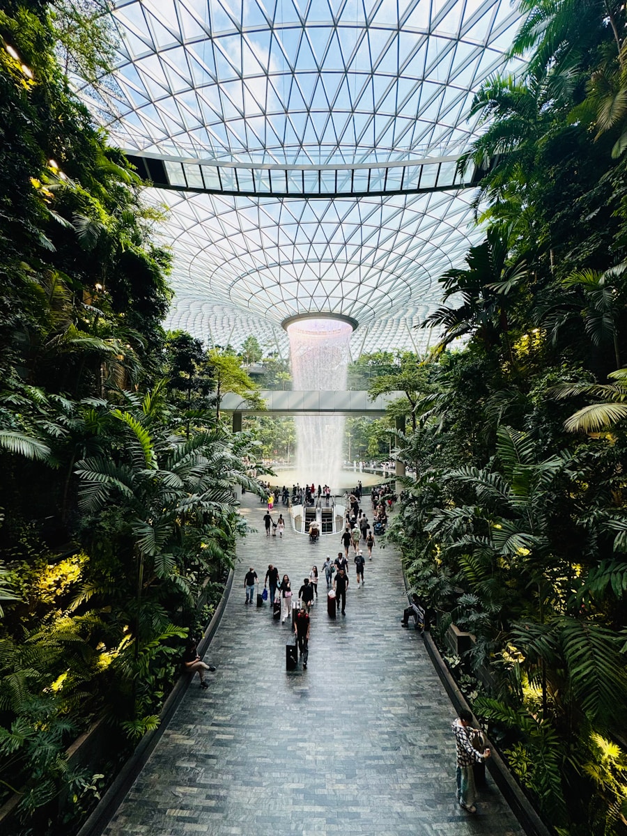 A beautiful indoor waterfall and lush greenery.