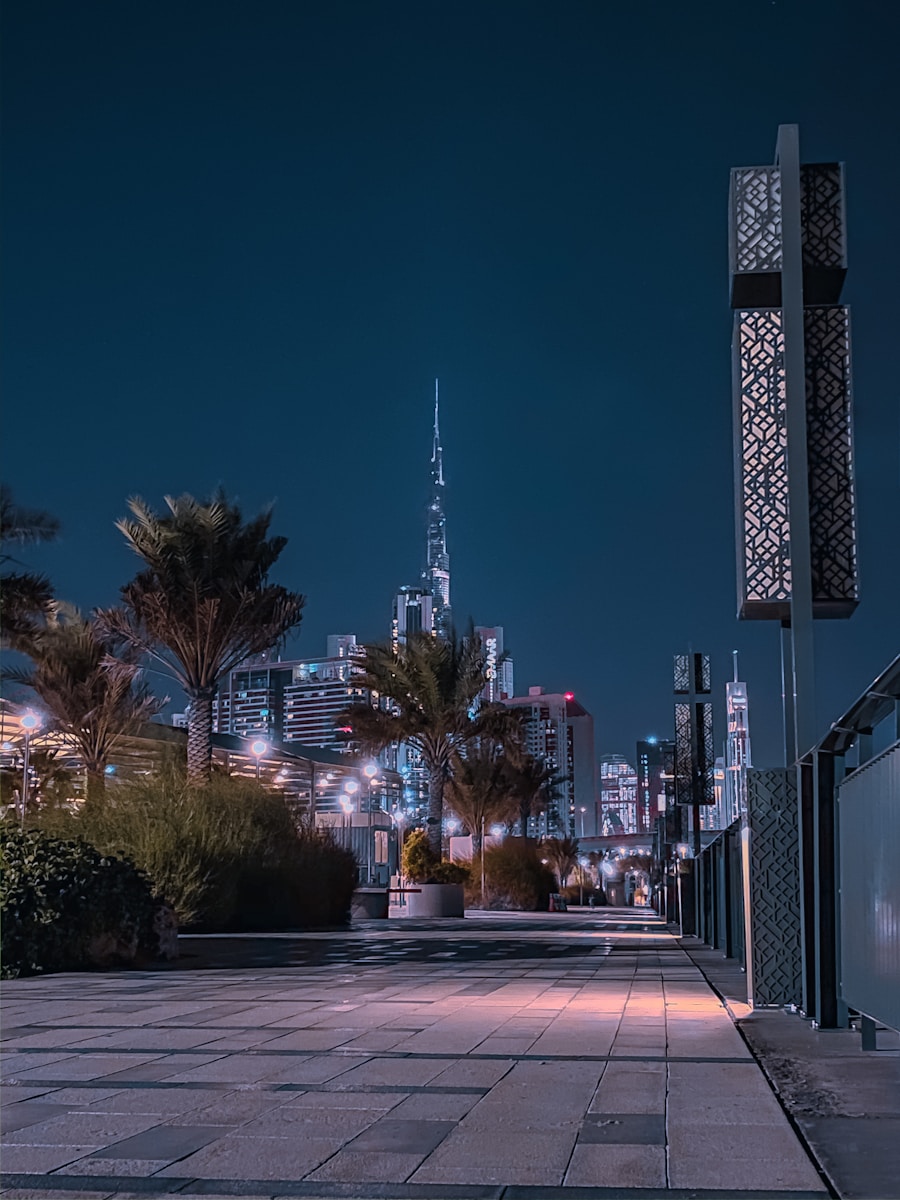 city buildings with lights turned on during night time
